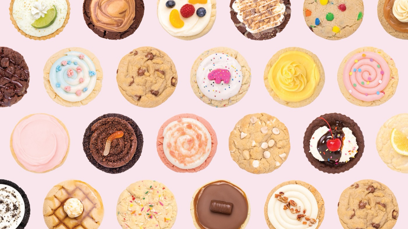 Rows of Crumbl cookies on a pink background